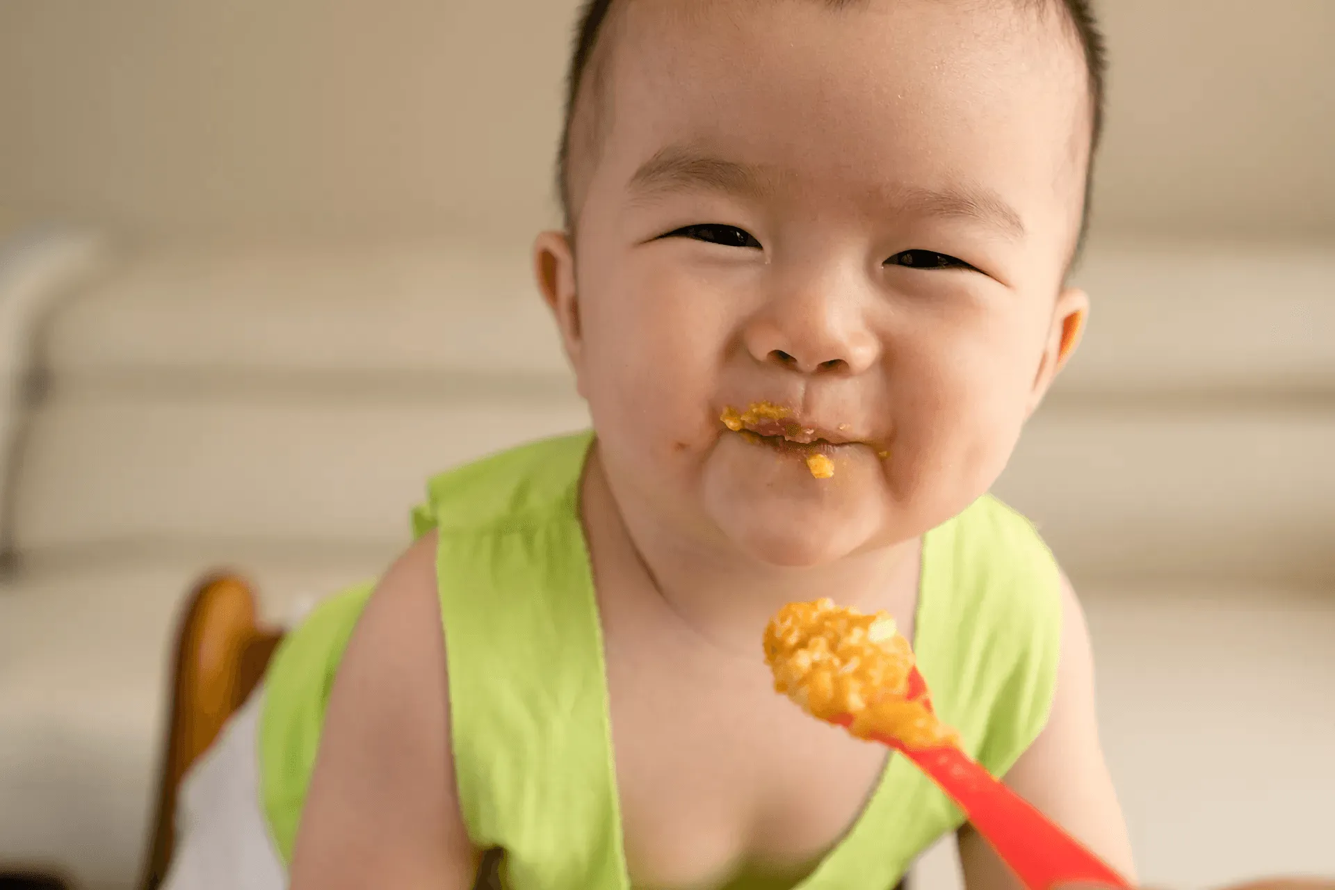 Baby eating food during mealtime